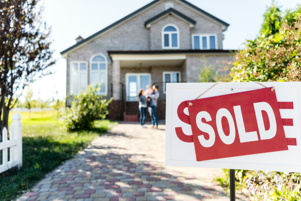 Sold new house with blurred family on background